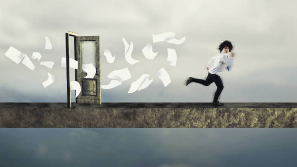 Young man run from papers, suggesting accumulation of unpaid bills