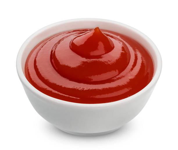 istock Bowl of ketchup isolated on white background 866287550