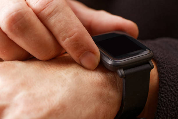istock Closeup hands of man using his smartwatch 866290574
