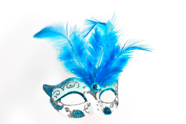 Elegant ladies' white masquerade mask with sequins, blue glass bead and feathers close up  on a white background isolated