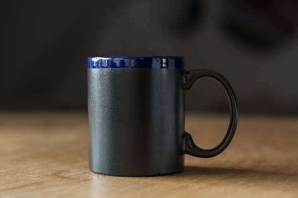 istock A hot black mug with steam above it 866297240