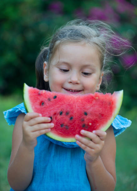 istock Little girl eating watermelon 866299254