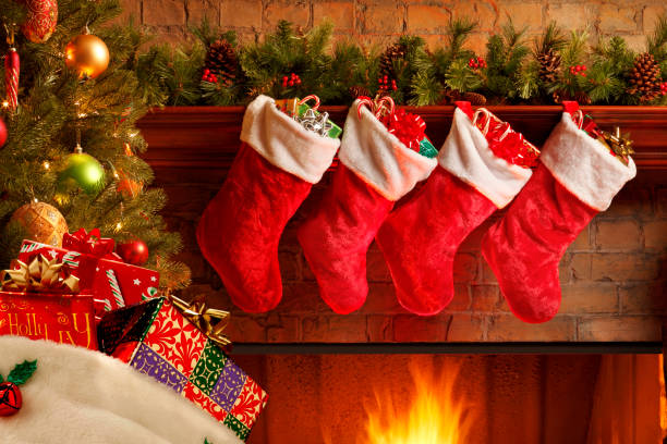 istock Santa's Bag In Front Of Christmas Tree And Fireplace 866301102