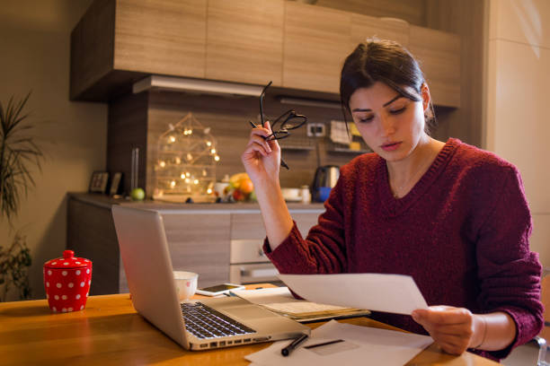 young woman working from home stock photo