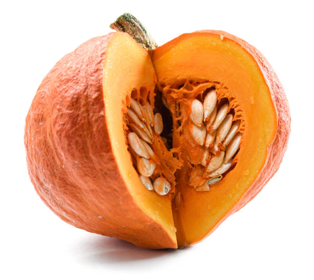 istock Organic ripe bright orange pumpkin cut with seeds isolated on white background 866303390