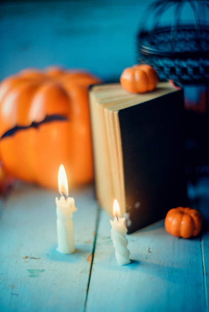 istock Halloween - Lanterns And Pumpkins On Wooden Table In A Haunted Forest 866303410
