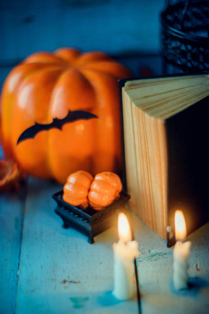 istock Halloween - Lanterns And Pumpkins On Wooden Table In A Haunted Forest 866303692