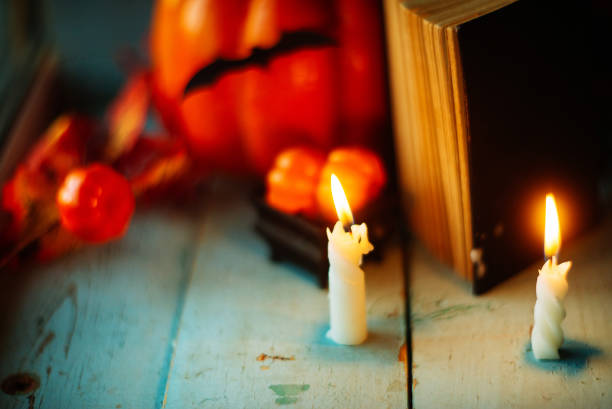 istock Halloween - Lanterns And Pumpkins On Wooden Table In A Haunted Forest 866304344