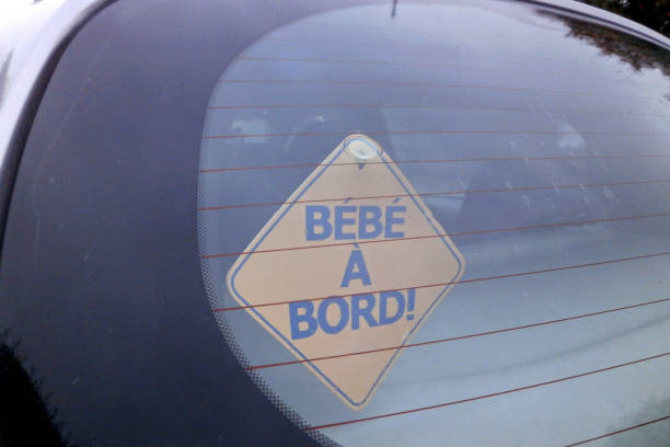 istock French Baby on board yellow car Sticky sign 866309512