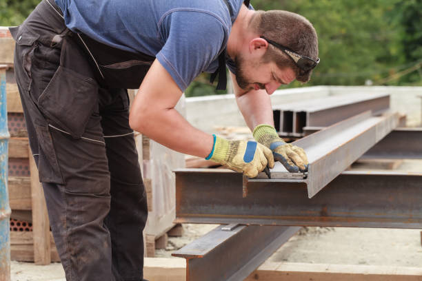 istock A man marks a metal product before cutting 866310088