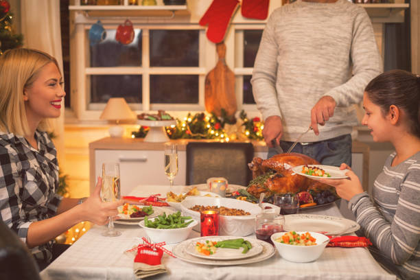 istock Carving Traditional Stuffed Turkey For Christmas 866310514