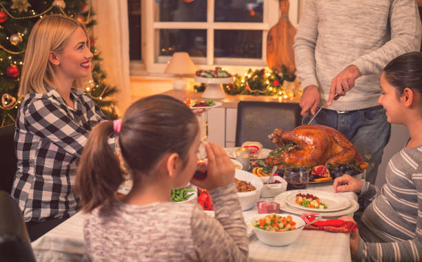 istock Carving Traditional Stuffed Turkey For Christmas 866310526