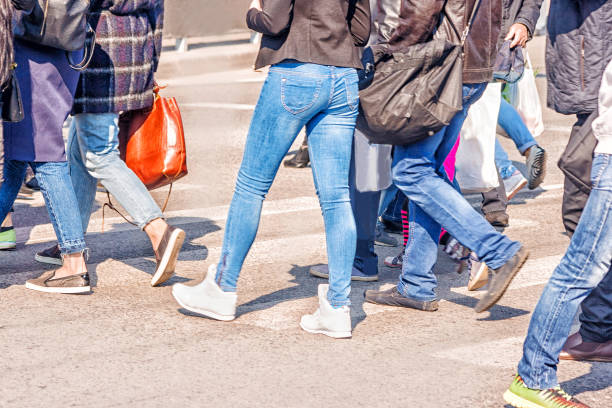istock feet of the people going on the street 866317618