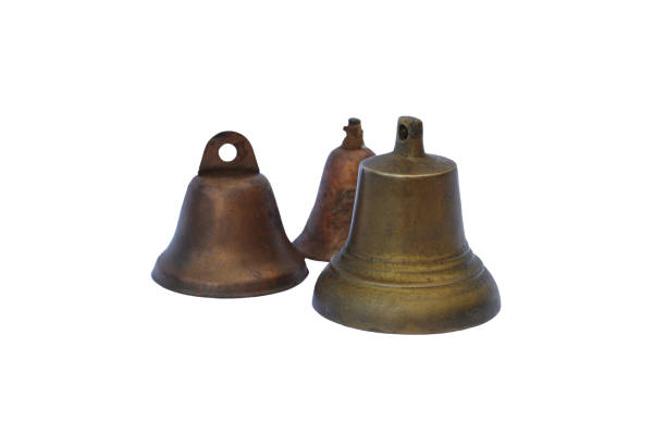 istock Three vintage brass bells isolated on white background 866317988