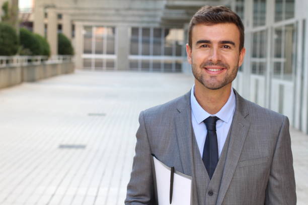 istock Good looking male isolated in office space 866325268