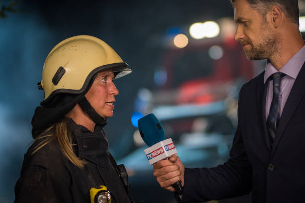 istock Reporter and female firefighter 866325392