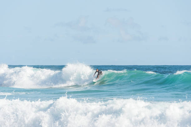 istock Solo male surfer in Hawaii dropping in 866327278