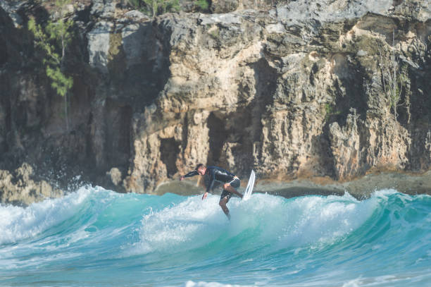 istock Solo male surfer in Hawaii dropping in 866328116