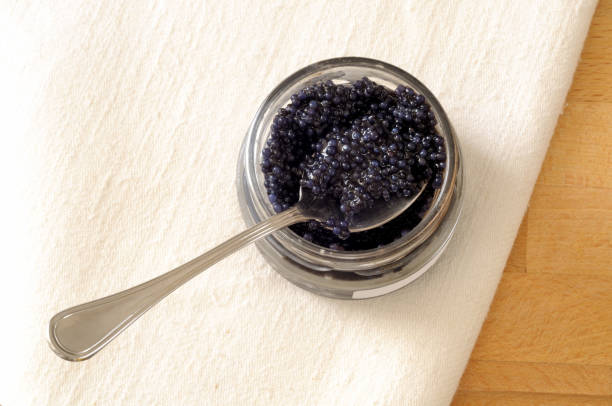 istock top view of black lumpfish eggs in a jar 866328834