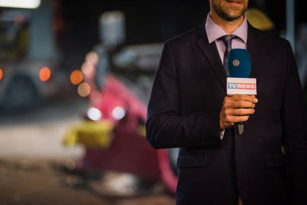 istock Reporter covering traffic disaster 866329464