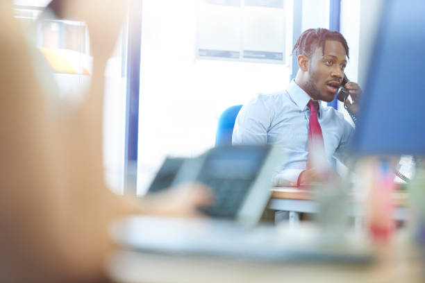 Businessman sat at his desk going through his daily routine