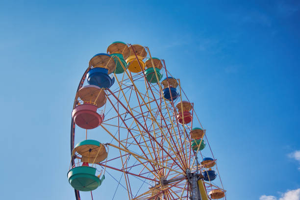 istock Ferris wheel on the background of blue sky 866340908