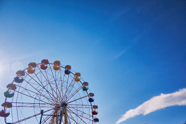 istock Ferris wheel on the background of blue sky 866340910