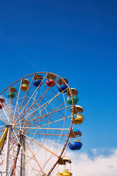 istock Ferris wheel on the background of blue sky 866340940