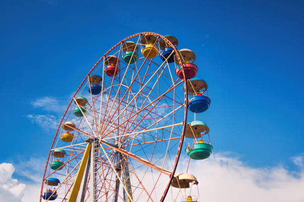 istock Ferris wheel on the background of blue sky 866340952
