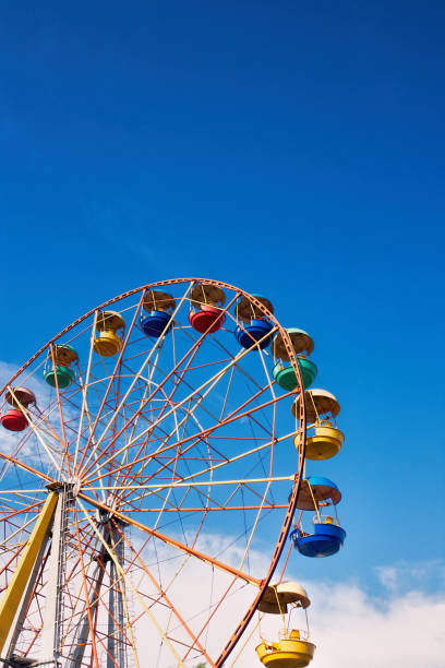 istock Ferris wheel on the background of blue sky 866340962