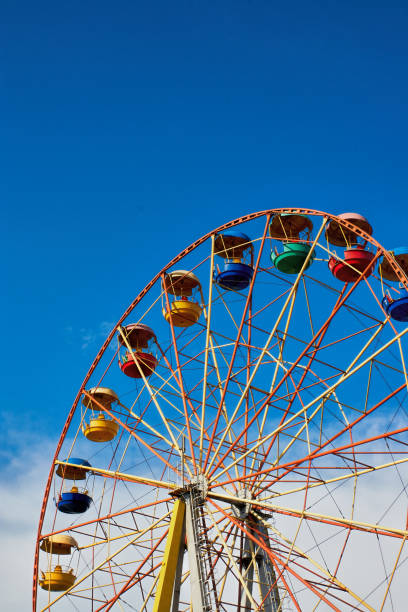 istock Ferris wheel on the background of blue sky 866340976