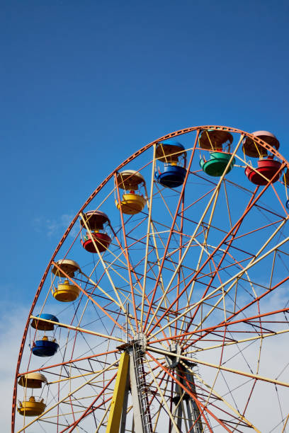 istock Ferris wheel on the background of blue sky 866340992
