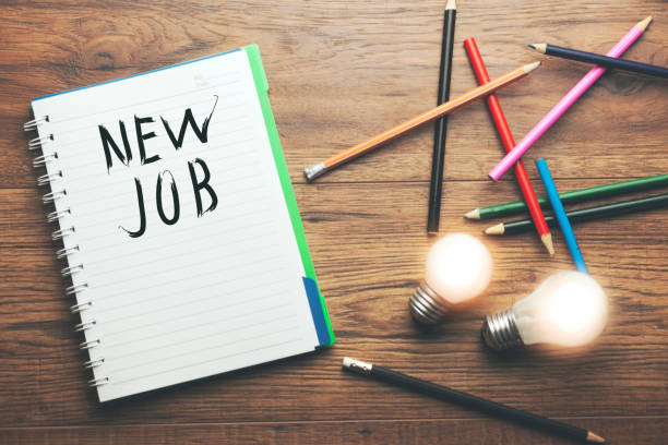 istock idea with new job text on notebook and pencils 866343704