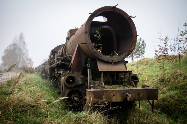 istock Old rusty trains. Old abandoned track, siding with dirty old trains. Old railway tracks 866349906