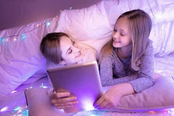 istock Delighted mother and daughter relaxing and smiling 866351076