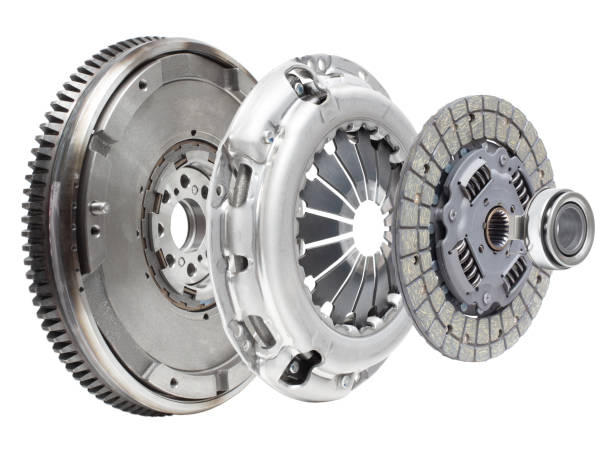 A new set of replacement automotive clutch on a white background. Disc and clutch basket with release bearing A new set of replacement automotive clutch on a white background. Disc and clutch basket with release bearing ball bearing photos stock pictures, royalty-free photos & images