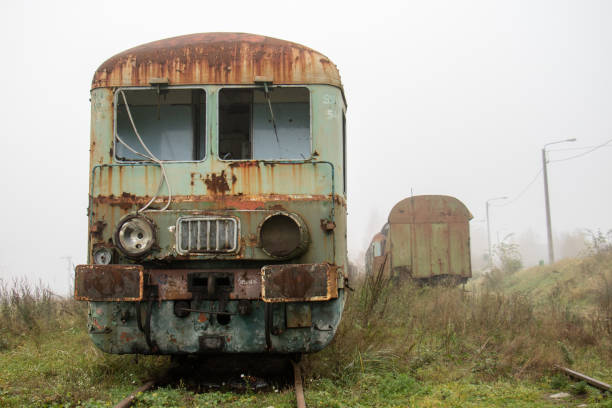 istock Old rusty trains. Old abandoned track, siding with dirty old trains. Old railway tracks 866354936