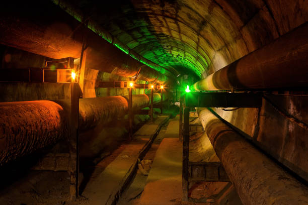 istock Dirty tunnel of heating duct with rusty pipeline 866357510