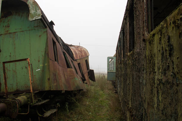 istock Old rusty trains. Old abandoned track, siding with dirty old trains. Old railway tracks 866360590