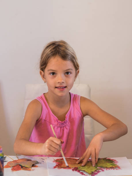 istock Cute girl making paint art 866360718
