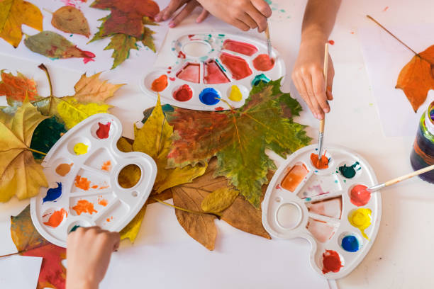 istock Unrecognizable children painting 866361124