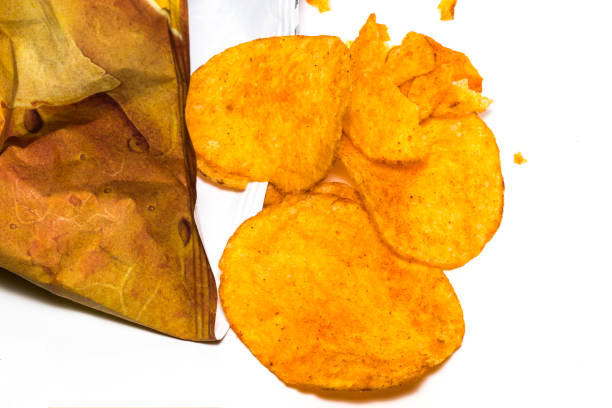 istock Opened pack of delicious spicy potato chips on a white background 866361606