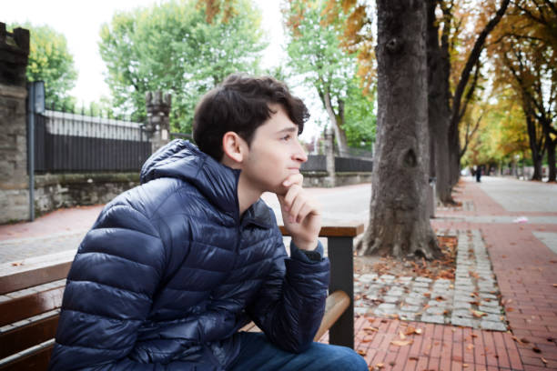 Unhappy, worried, young adult man.