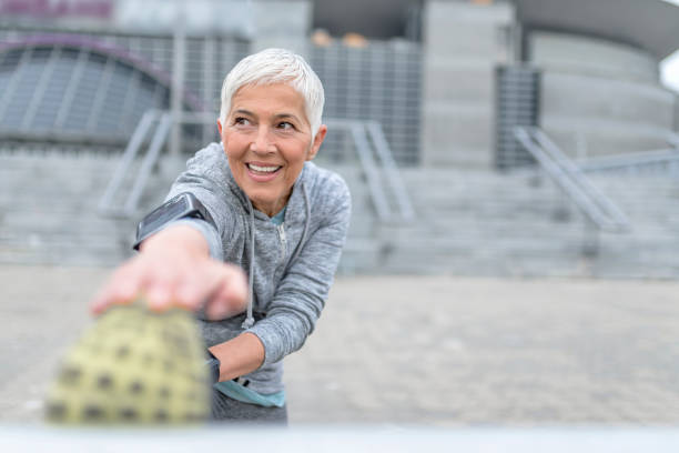 istock Mature Woman Working Stretching Exercise 866367552