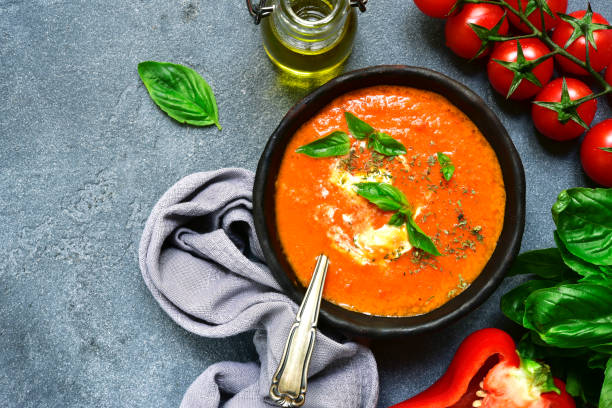 istock Cold tomato soup (gazpacho or salmorejo) in a black bowl 866371716