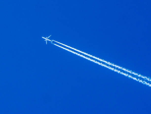 istock blue sky with vapor trails 866374690