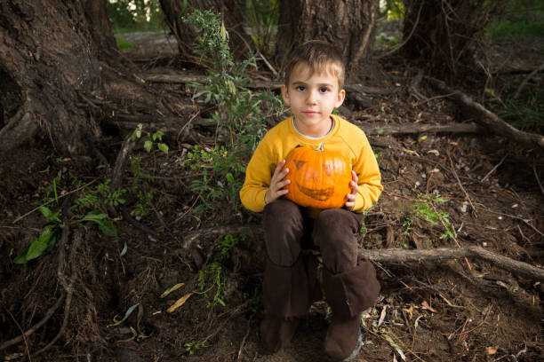 istock Little boy with pumpkin ready for Halloween 866379120
