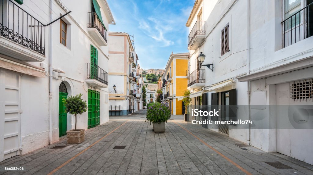 Typical street in old town of Ibiza, Balearic Islands, Spain Typical street in old town of Ibiza, Balearic Islands, Spain. Morning light. Wide angle Ibiza Island Stock Photo