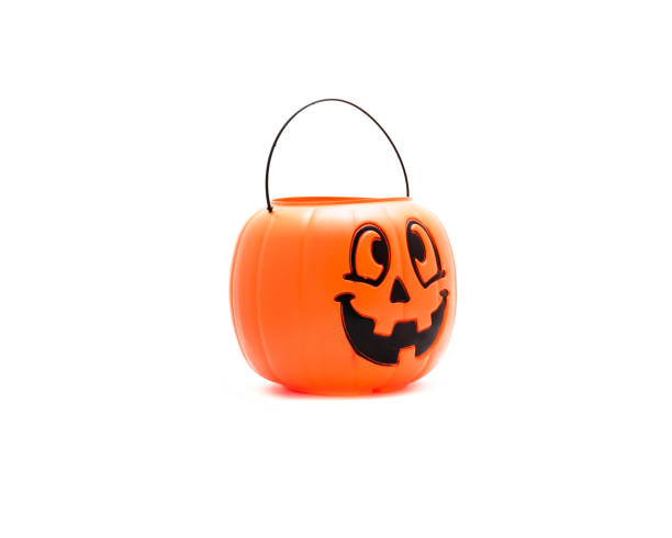 istock Studio shot Jack O' Lantern Halloween pumpkin pail isolated on white 866382596