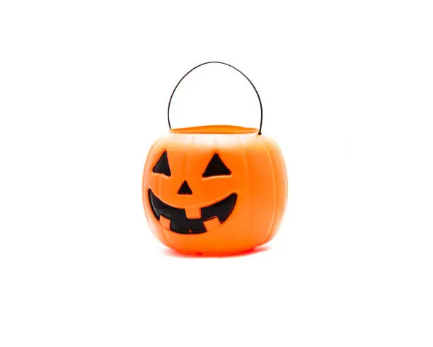 Photo of Studio shot Jack O' Lantern Halloween pumpkin pail isolated on white